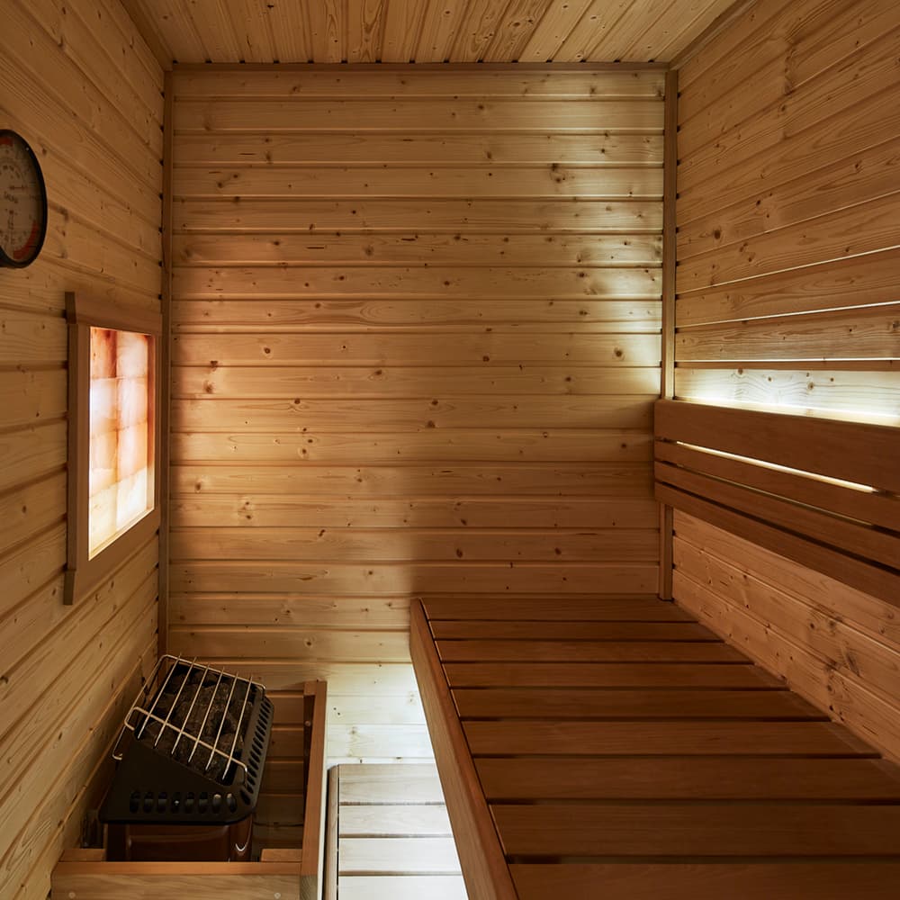 Woman stretching in sauna